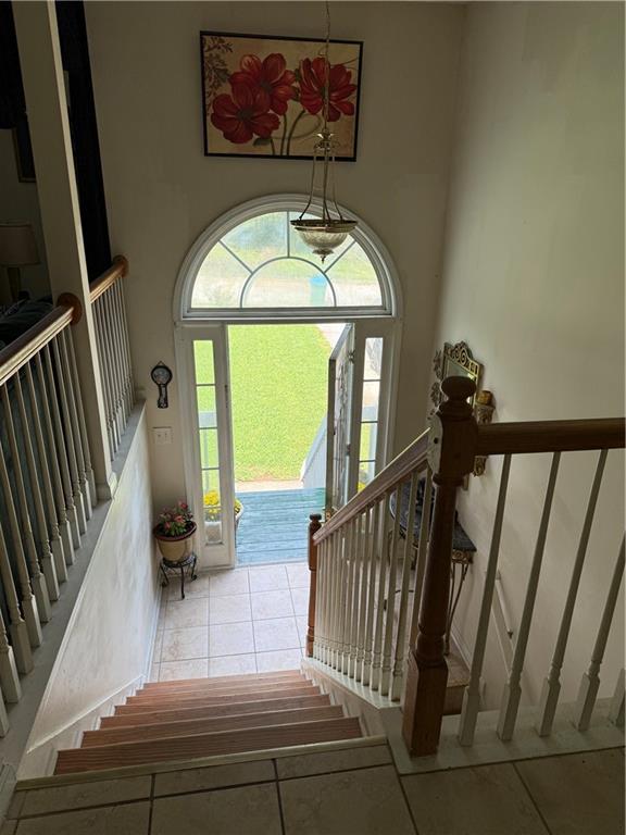 3903 Doe Run Drive Powder Springs, GA 30127 - Photo 42 of 60 a view of staircase with wooden floor and a potted plant