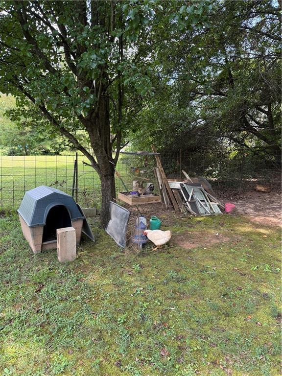 3903 Doe Run Drive Powder Springs, GA 30127 - Photo 8 of 60 a view of a house with backyard and sitting area