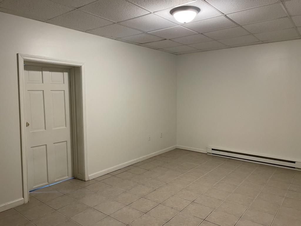 4429 Steuben Road, Unit 101 Bethlehem, PA 18020 - Photo 6 of 10 A well-lit, adaptable room features tiled flooring and practical baseboard heating.