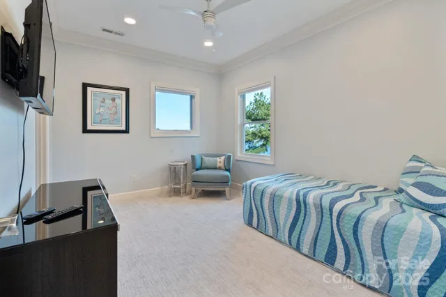 a bedroom with furniture and a window