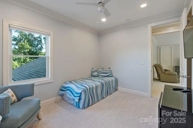 a bedroom with furniture and a window