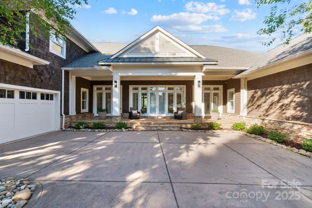 a view of a house with outdoor space and a garden