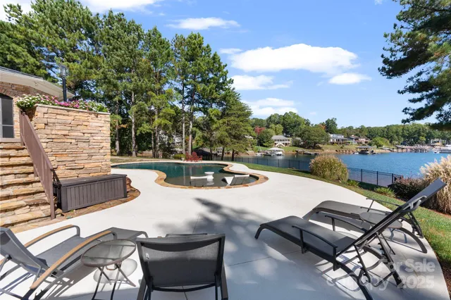 a view of a patio with swimming pool