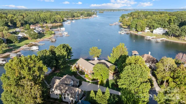 an aerial view of a house with a lake view