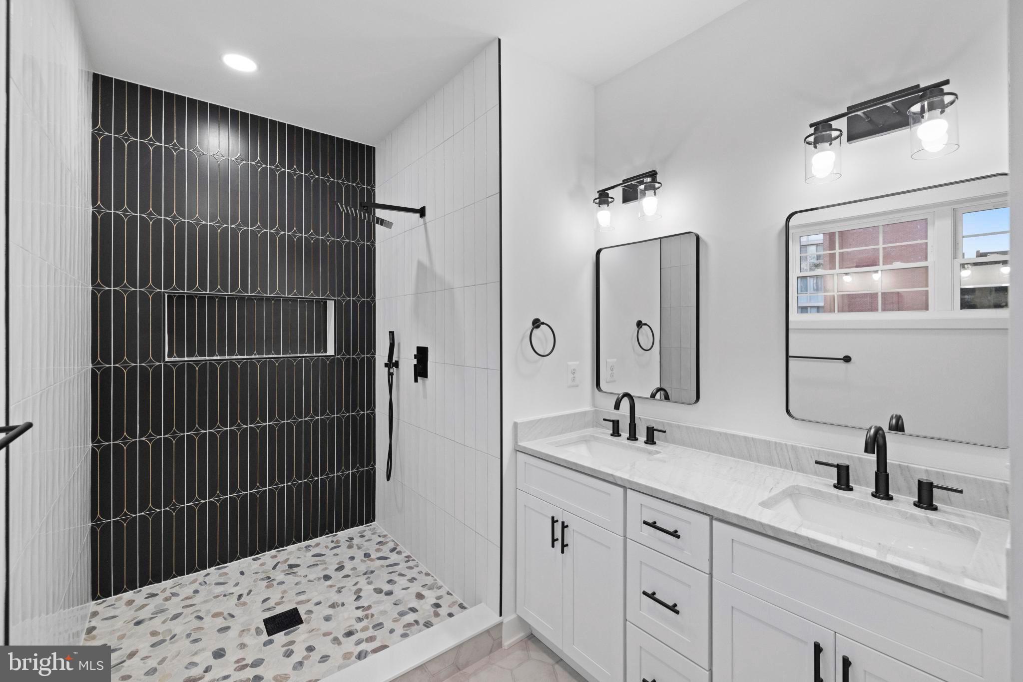 237 Brock Bridge Road Laurel, MD 20724 - Photo 18 of 64 a bathroom with a sink double vanity and a shower