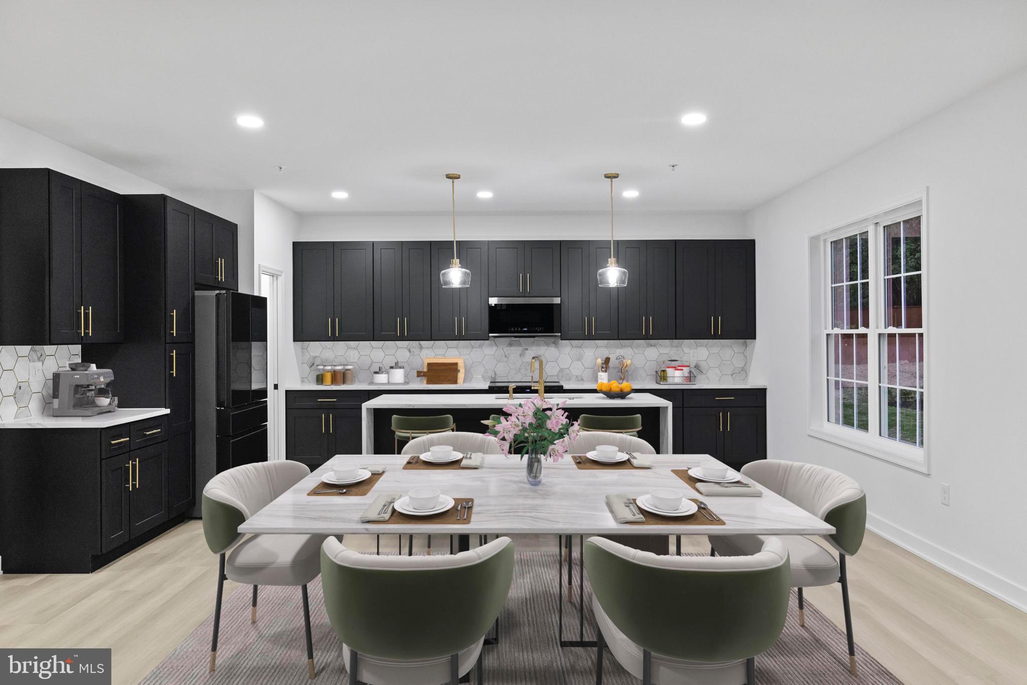 237 Brock Bridge Road Laurel, MD 20724 - Photo 2 of 64 a kitchen with stainless steel appliances kitchen island granite countertop a sink a stove a dining table and chairs