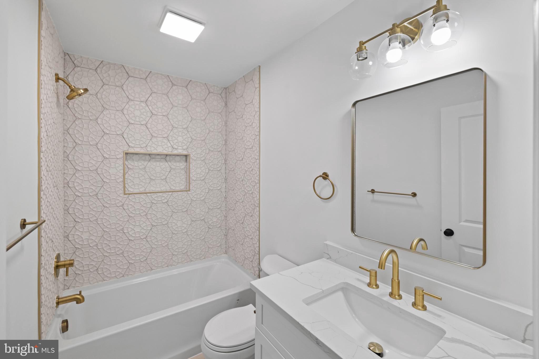 237 Brock Bridge Road Laurel, MD 20724 - Photo 34 of 64 a bathroom with a sink a toilet and shower