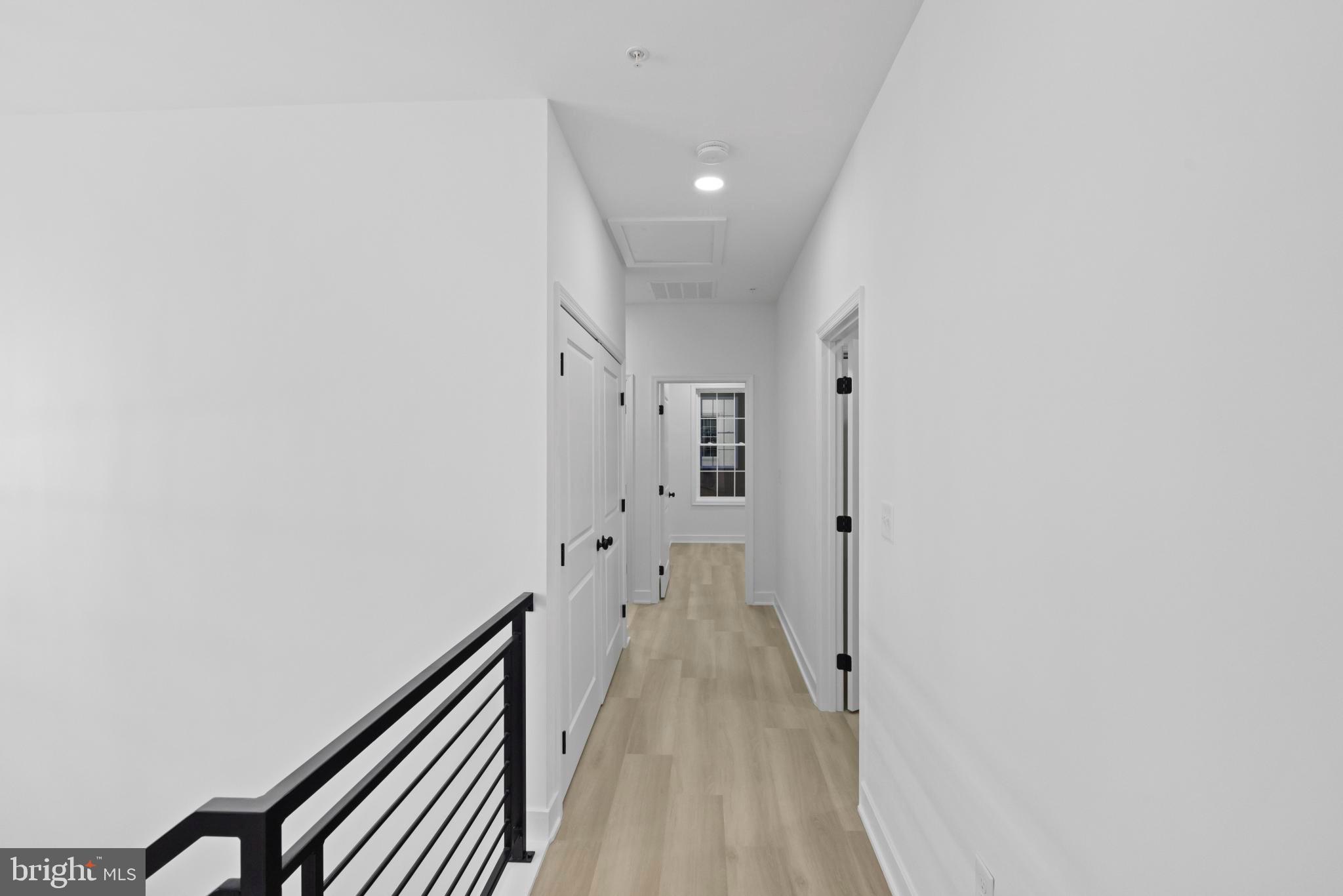 237 Brock Bridge Road Laurel, MD 20724 - Photo 35 of 64 a view of a hallway with wooden floor and staircase
