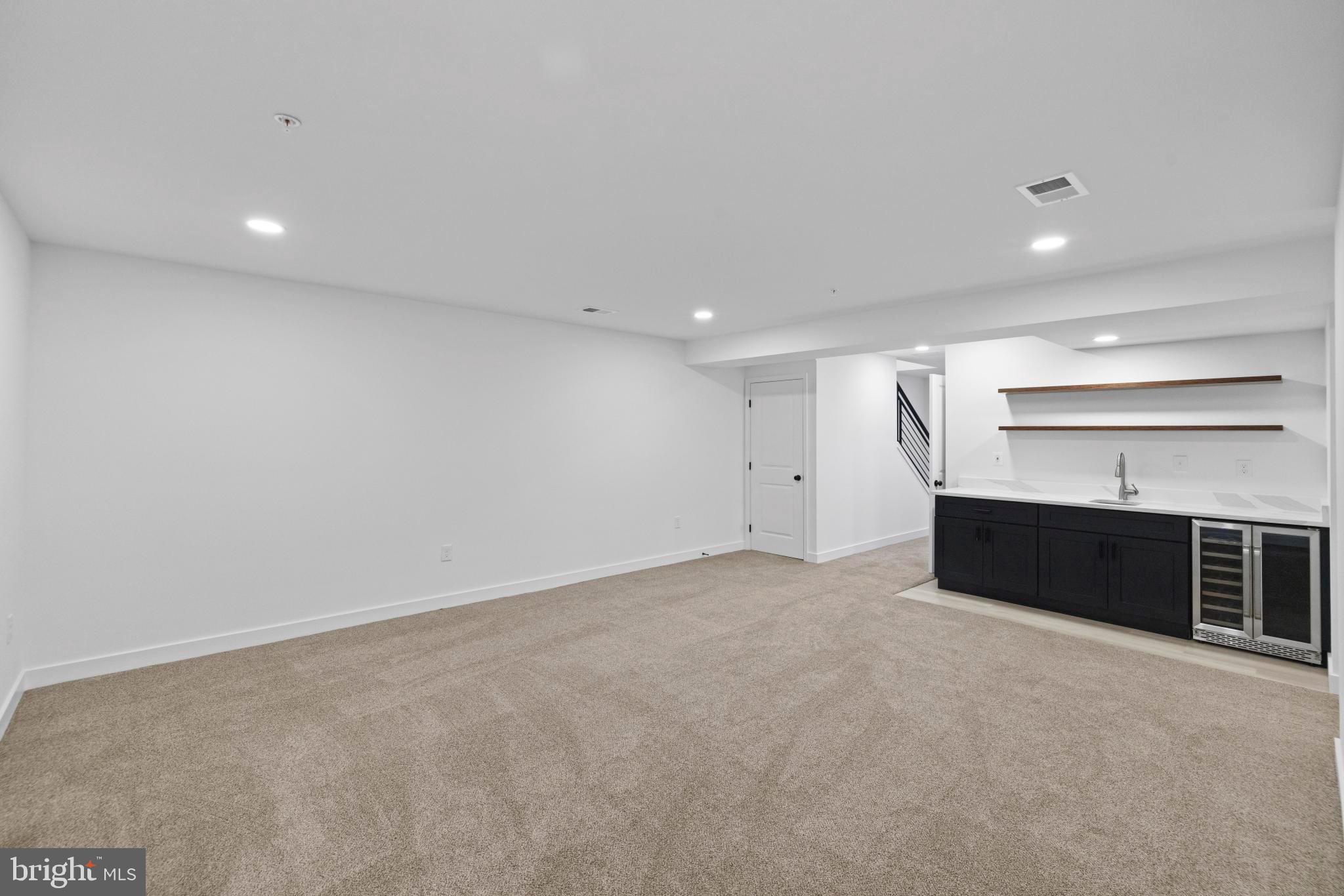 237 Brock Bridge Road Laurel, MD 20724 - Photo 46 of 64 an empty room with furniture and a fireplace