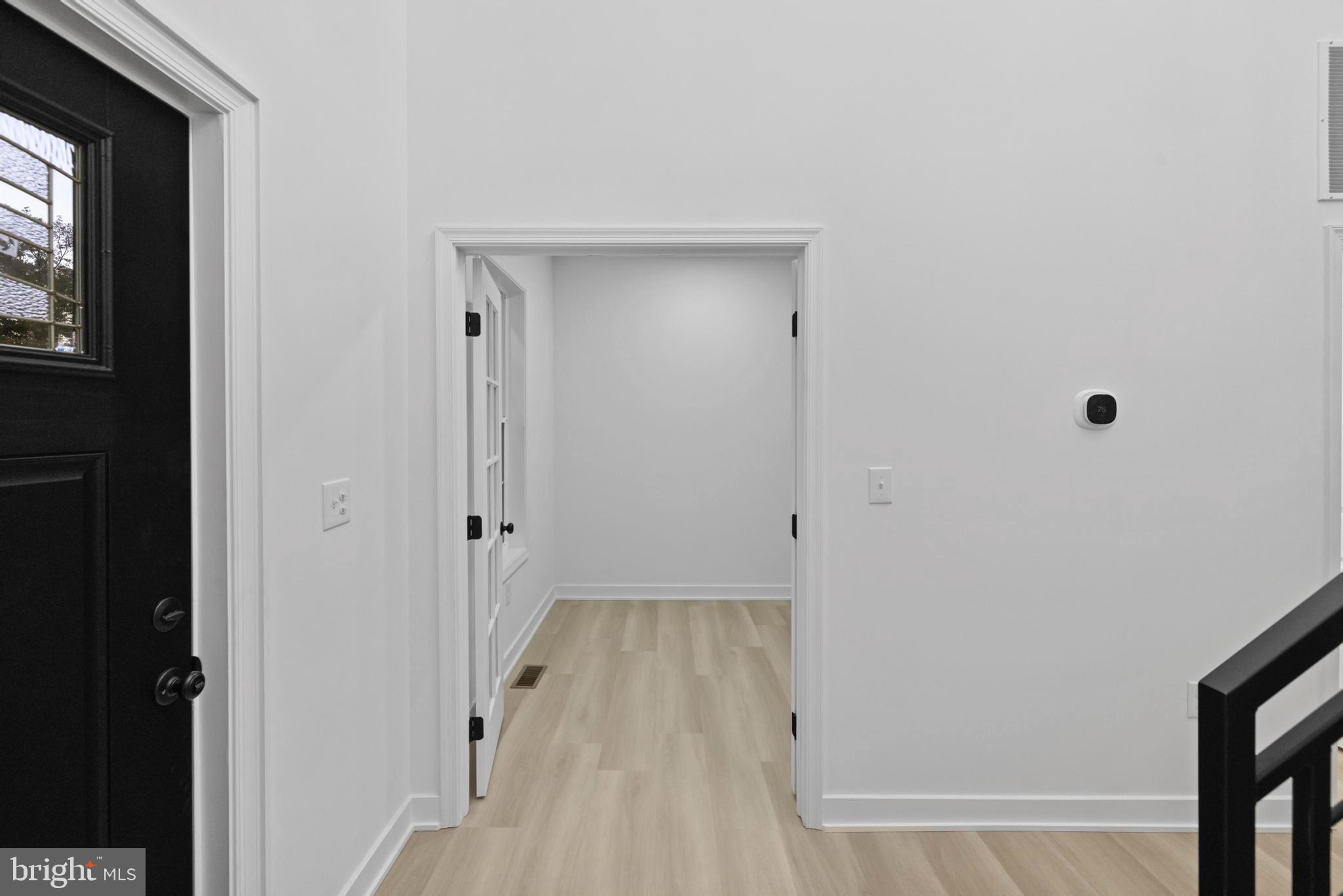237 Brock Bridge Road Laurel, MD 20724 - Photo 50 of 64 a view of a hallway with wooden floor and closet