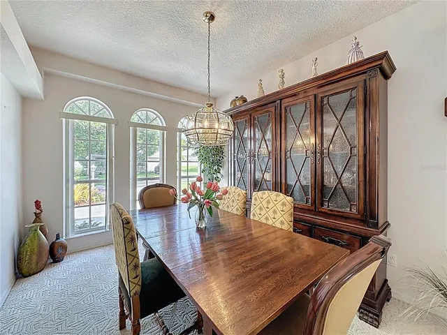 a living room with furniture ceiling fan and a fireplace