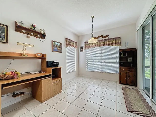 a spacious bathroom with a granite countertop sink and a mirror