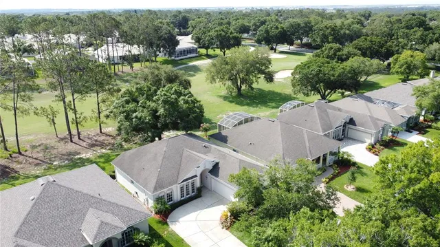 an aerial view of residential house with outdoor space and lake view