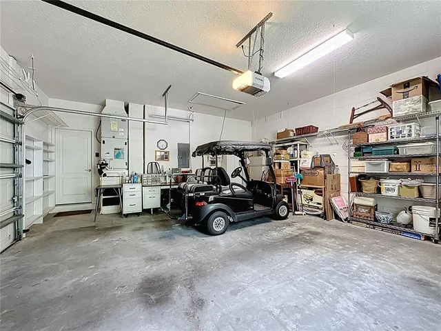 a view of a house with swimming pool and sitting area