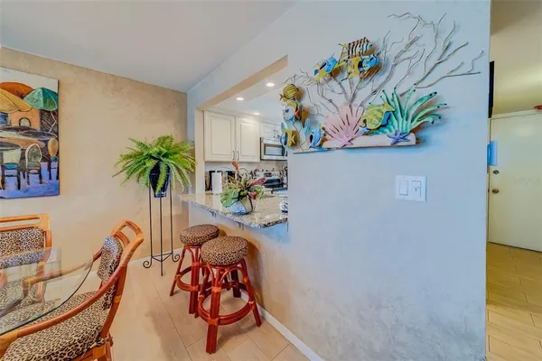 a kitchen with stainless steel appliances granite countertop a stove sink and cabinets