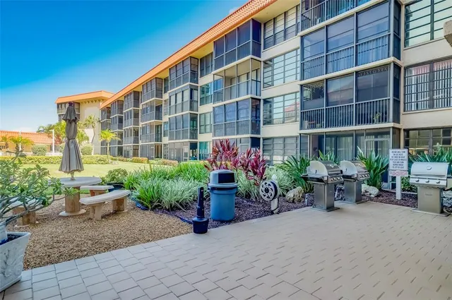 a view of a swimming pool with a lounge chair