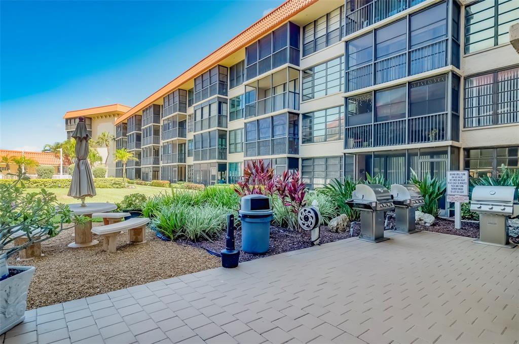 17580 Gulf Boulevard, Unit 412 Redington Shores, FL 33708 - Photo 41 of 67 a front view of a building with outdoor seating