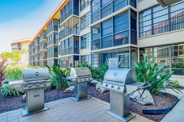 a view of a backyard with sitting area