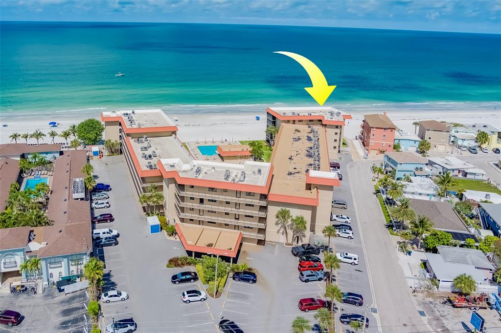 17580 Gulf Boulevard, Unit 412 Redington Shores, FL 33708 - Photo 56 of 67 an aerial view of residential house with outdoor space and swimming pool