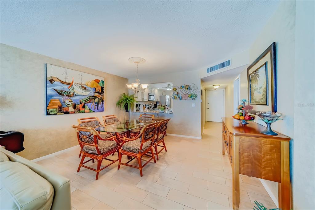 17580 Gulf Boulevard, Unit 412 Redington Shores, FL 33708 - Photo 8 of 67 a dining room with furniture and window