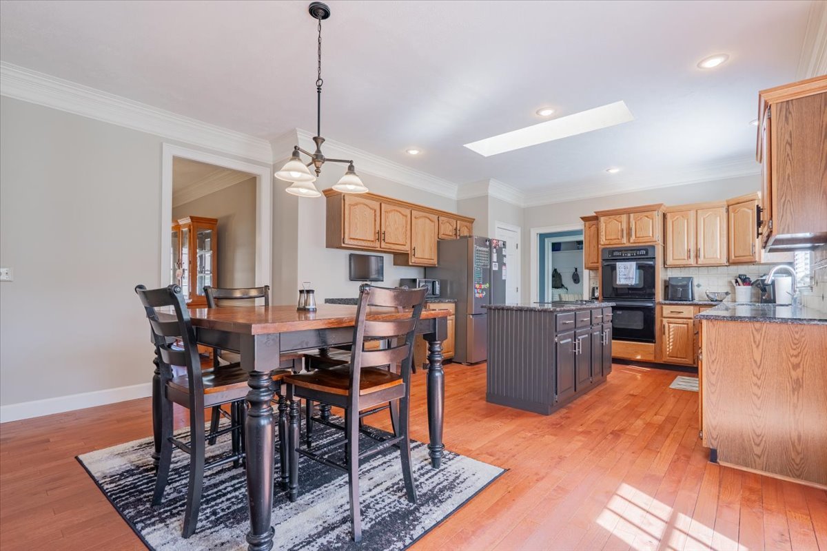 3 Downing Circle Bloomington, IL 61704 - Photo 11 of 47 a view of a dining room with furniture window and wooden floor