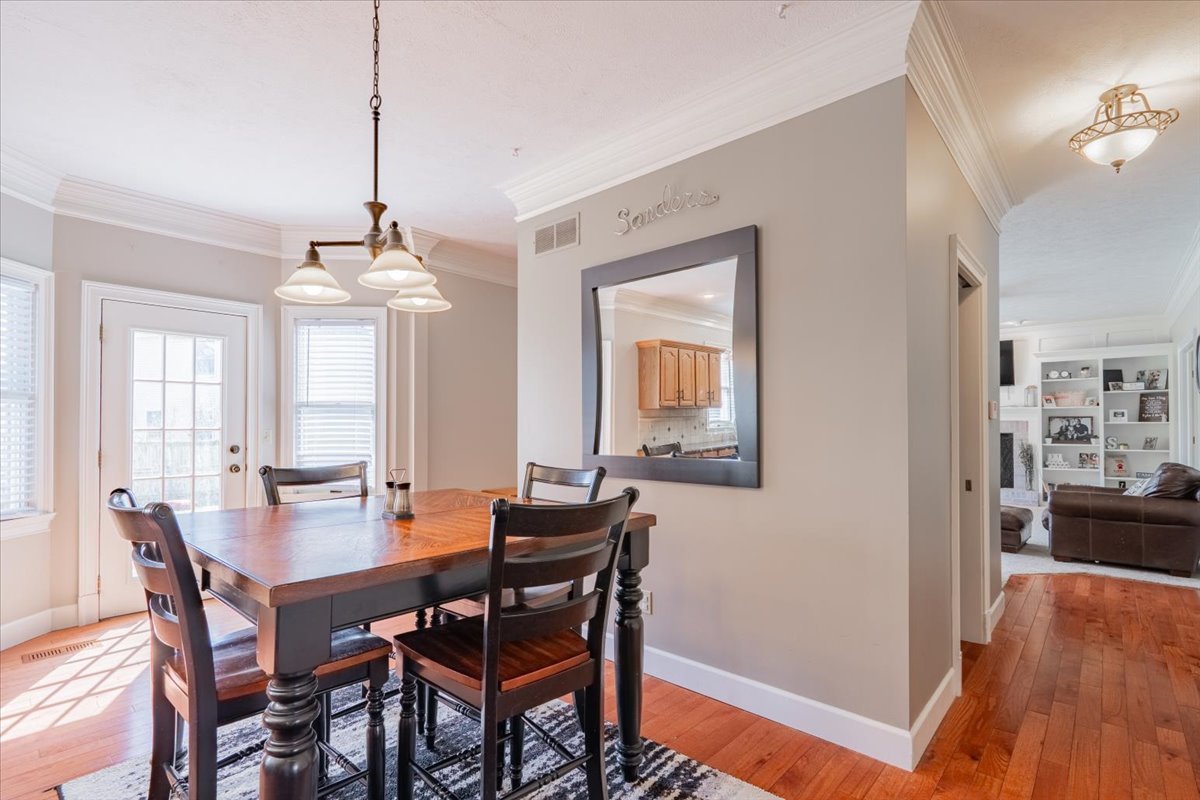 3 Downing Circle Bloomington, IL 61704 - Photo 12 of 47 a view of a dining room with furniture window and wooden floor