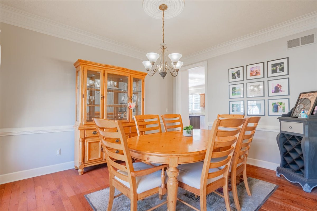 3 Downing Circle Bloomington, IL 61704 - Photo 17 of 47 a dining room with furniture a chandelier and wooden floor