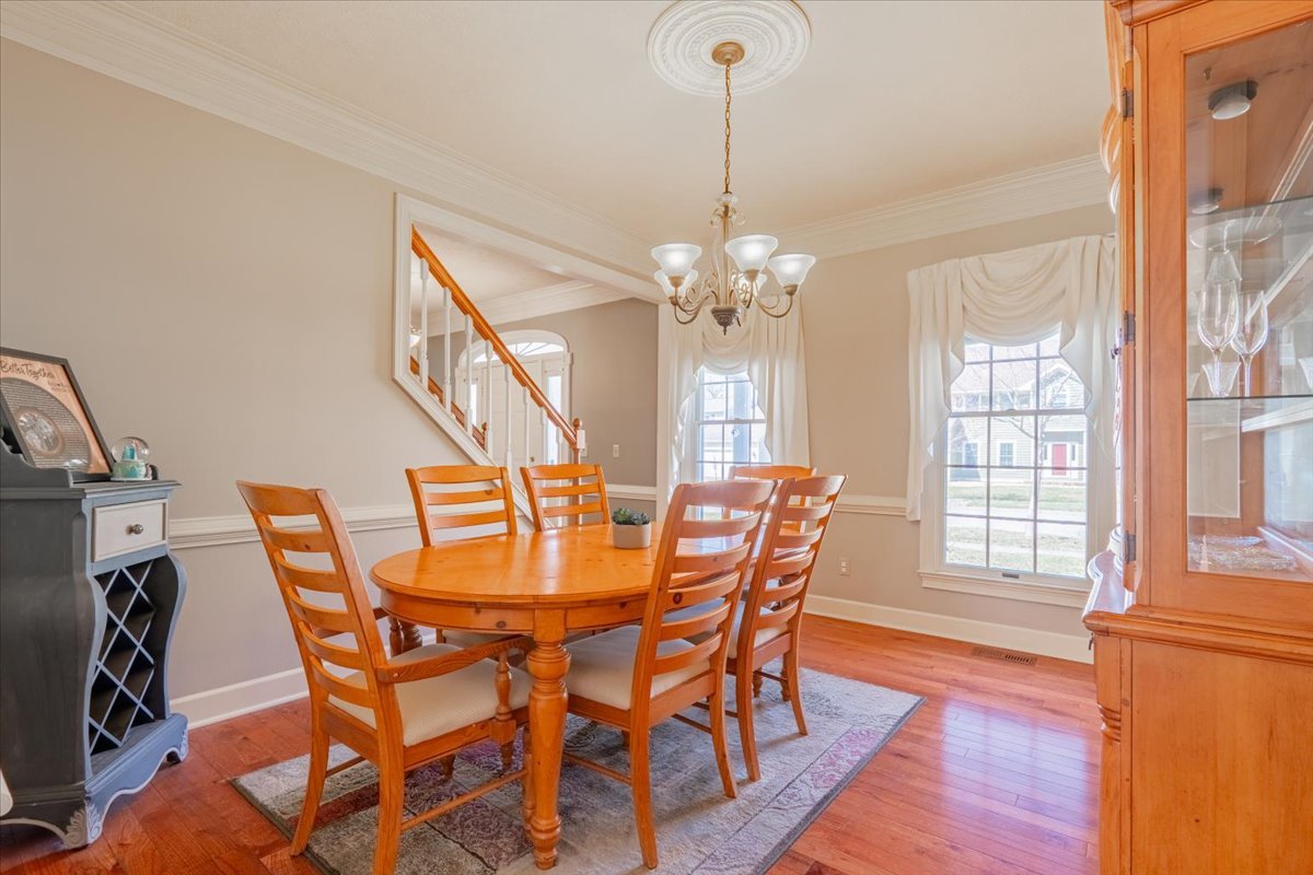 3 Downing Circle Bloomington, IL 61704 - Photo 18 of 47 a view of a dining room with furniture wooden floor and chandelier