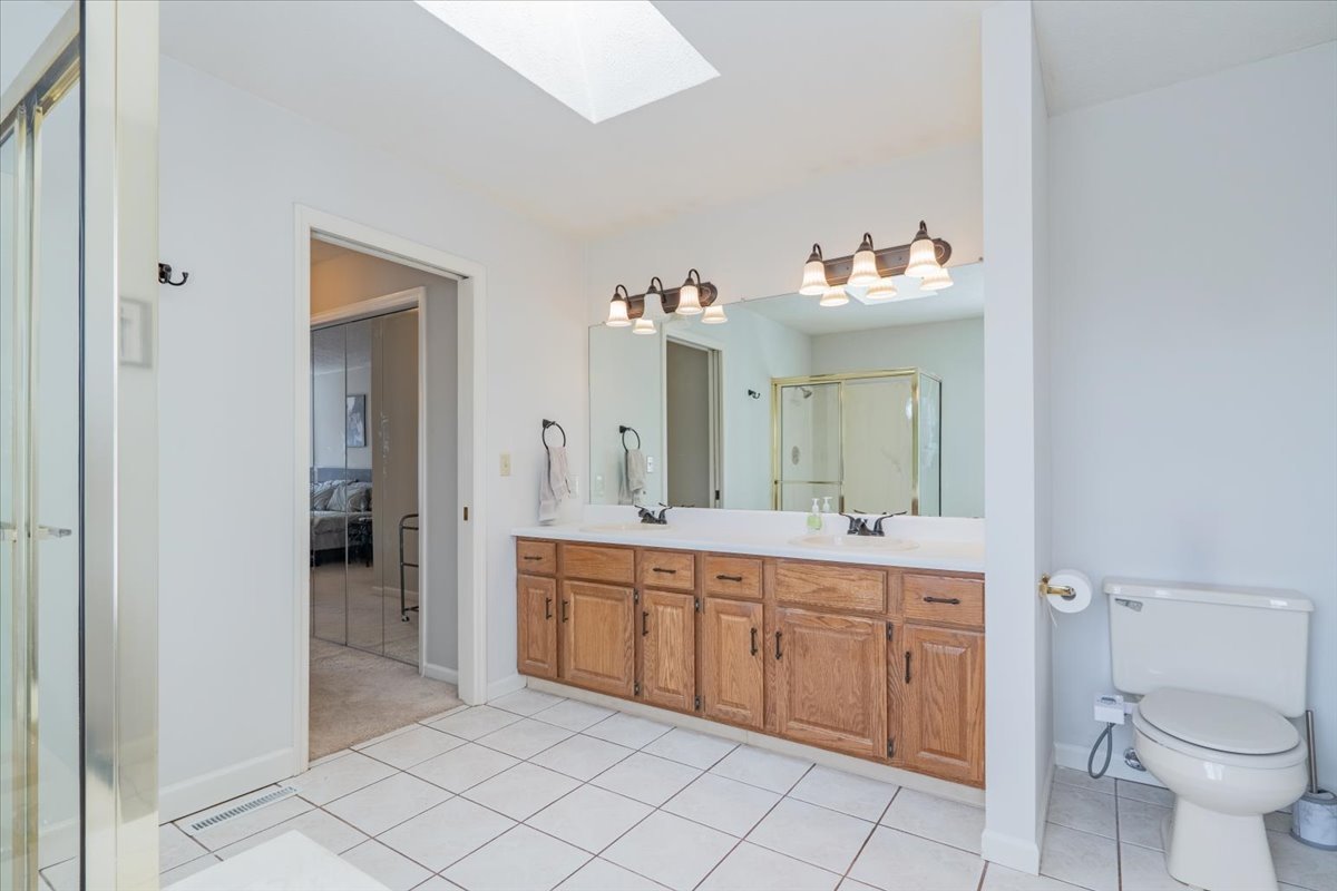 3 Downing Circle Bloomington, IL 61704 - Photo 24 of 47 a spacious bathroom with a double vanity sink mirror and toilet