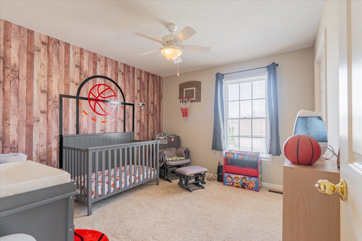 3 Downing Circle Bloomington, IL 61704 - Photo 25 of 47 a bedroom with furniture and a window