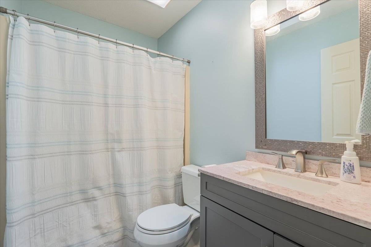 3 Downing Circle Bloomington, IL 61704 - Photo 27 of 47 a bathroom with a granite countertop sink toilet and shower