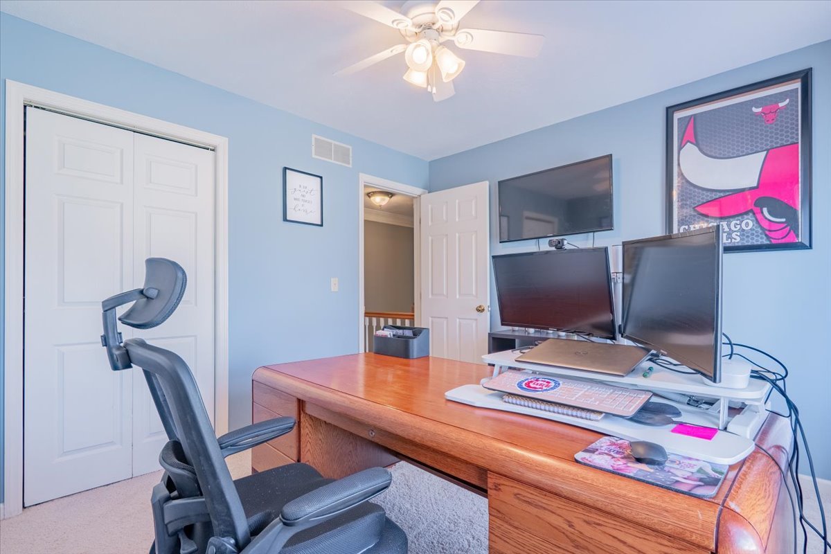 3 Downing Circle Bloomington, IL 61704 - Photo 31 of 47 a room with furniture and a flat screen tv