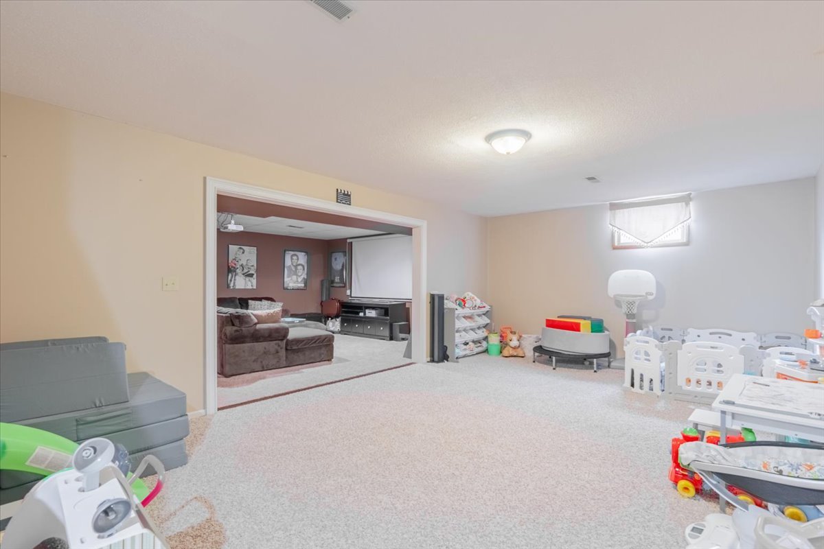 3 Downing Circle Bloomington, IL 61704 - Photo 34 of 47 a view of living room with furniture and cars