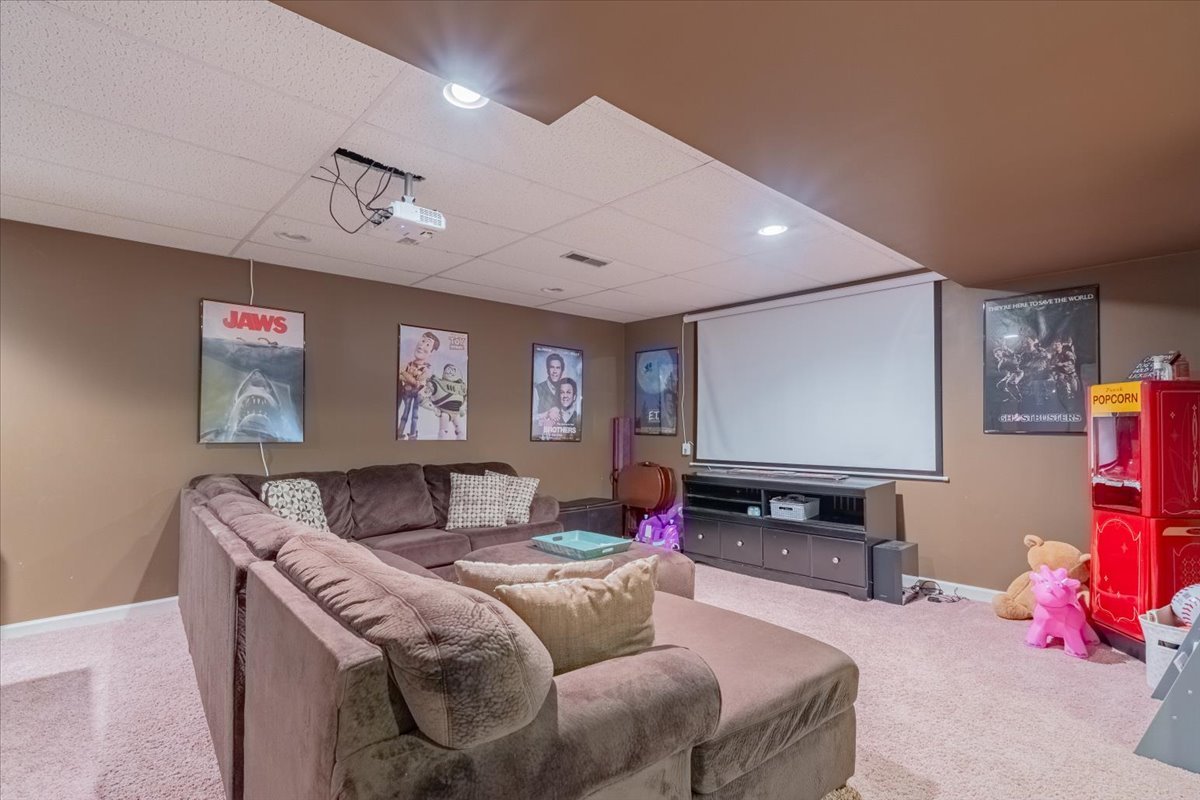 3 Downing Circle Bloomington, IL 61704 - Photo 36 of 47 a living room with furniture and a flat screen tv