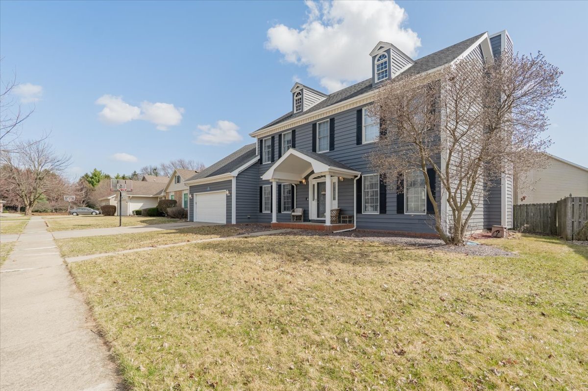 3 Downing Circle Bloomington, IL 61704 - Photo 43 of 47 a front view of a house with a yard and garage