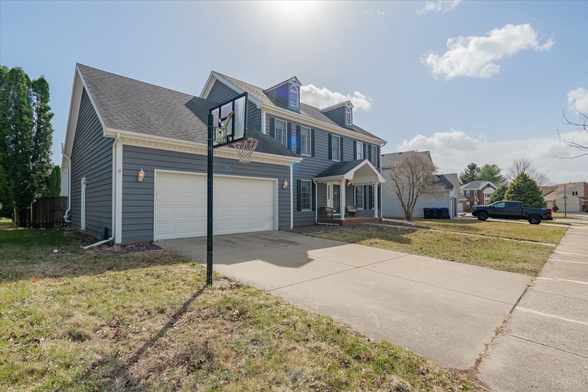 3 Downing Circle Bloomington, IL 61704 - Photo 44 of 47 a front view of a house with a yard and garage