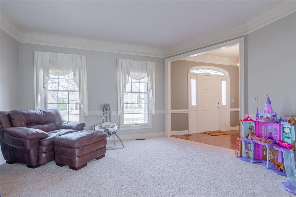 3 Downing Circle Bloomington, IL 61704 - Photo 5 of 47 a living room with furniture and a window