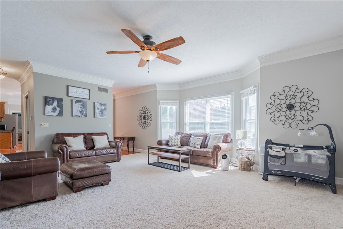 3 Downing Circle Bloomington, IL 61704 - Photo 6 of 47 a living room with furniture and a large window