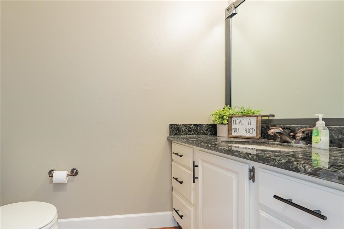 3 Downing Circle Bloomington, IL 61704 - Photo 9 of 47 a bathroom with a granite countertop sink and a toilet