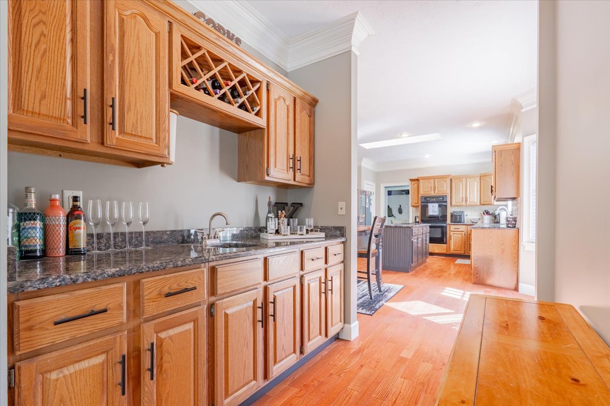 3 Downing Circle Bloomington, IL 61704 - Photo 10 of 47 a kitchen with stainless steel appliances granite countertop a sink and cabinets