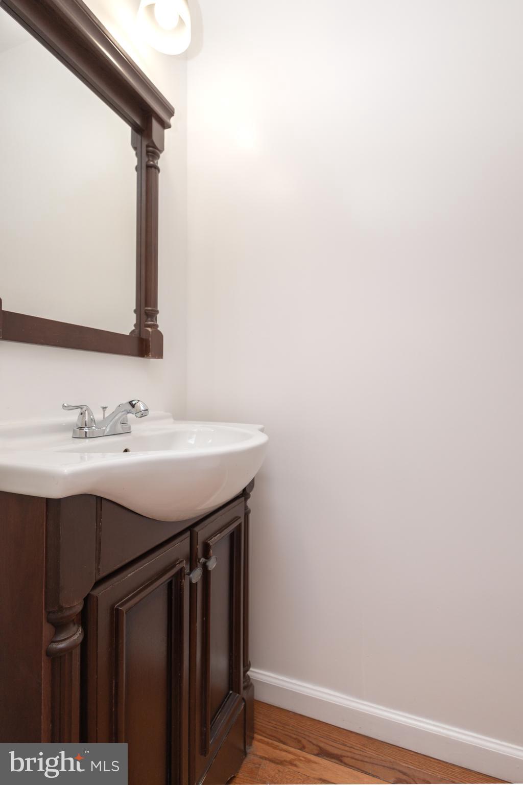 1911 17th Street Southeast Washington, DC 20020 - Photo 17 of 44 a bathroom with a sink vanity and a mirror
