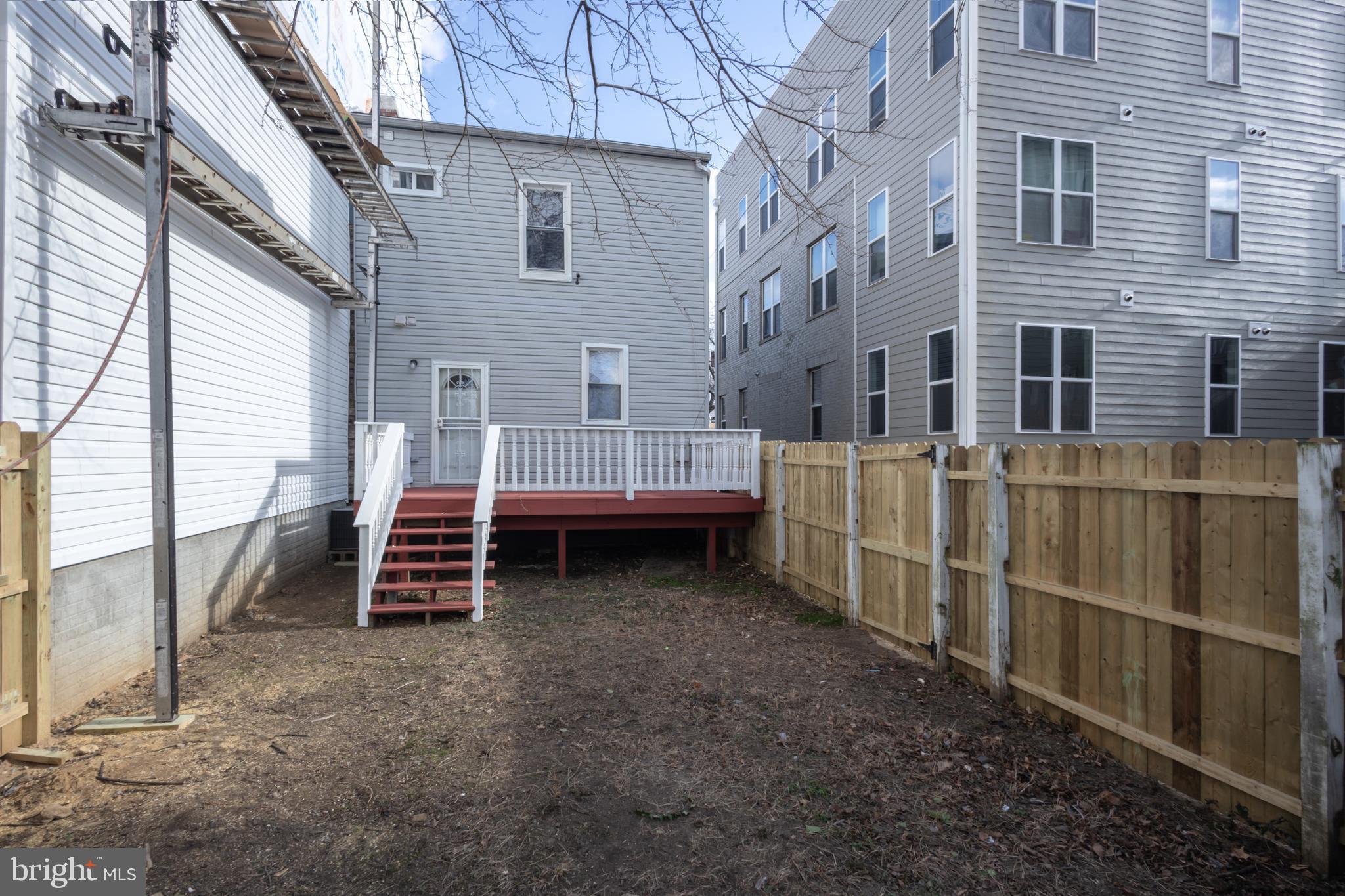 1911 17th Street Southeast Washington, DC 20020 - Photo 35 of 44 a view of a house with backyard and wooden fence