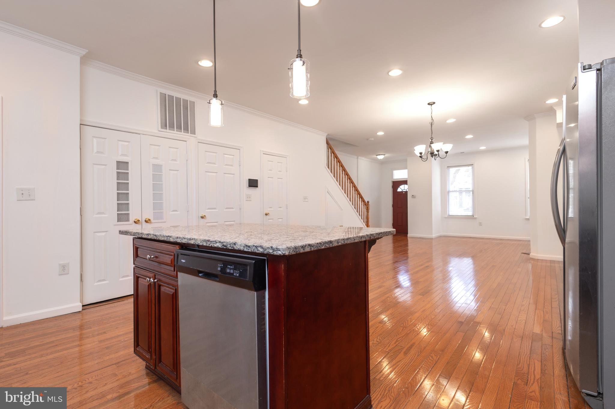 1911 17th Street Southeast Washington, DC 20020 - Photo 5 of 44 a view of a kitchen with a sink and wooden floor