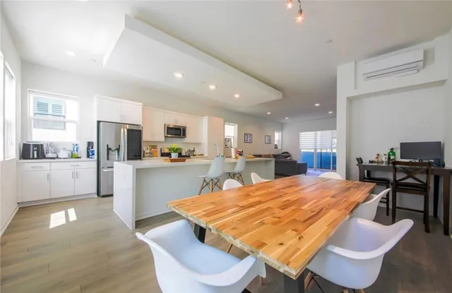 a kitchen with a table and chairs in it