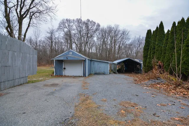 a wooden house with trees in front of it