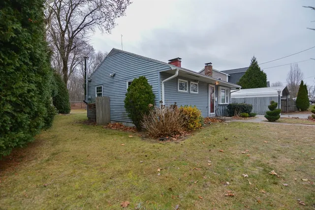 a view of a house with a yard and plants