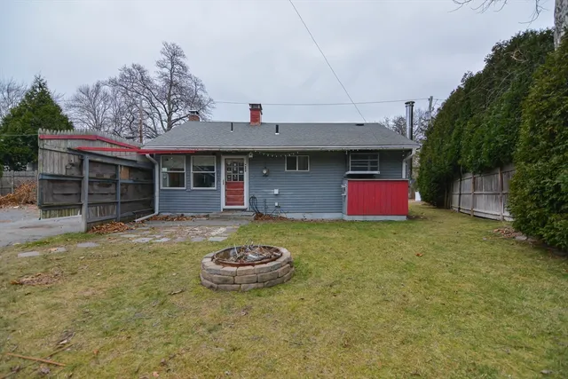 a view of a big house with a backyard