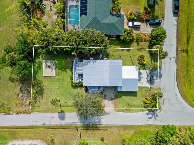 an aerial view of house with a swimming pool