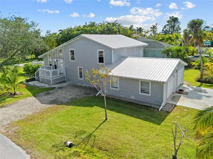 a aerial view of a house with a yard