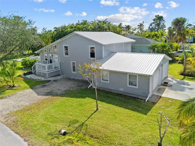 a aerial view of a house with a yard